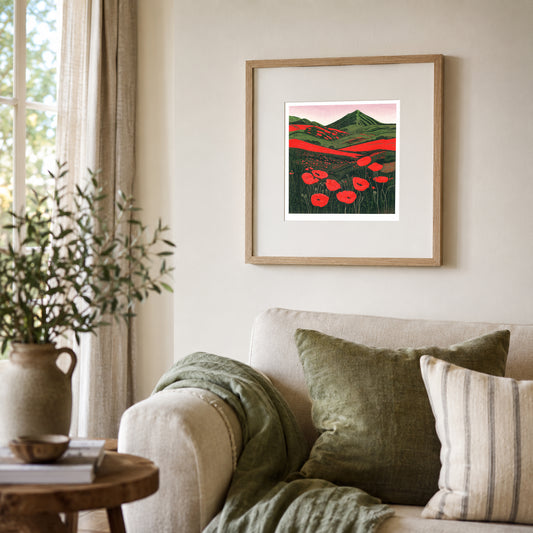 Hillside Poppies in Bloom original landscape linocut print framed on a wall