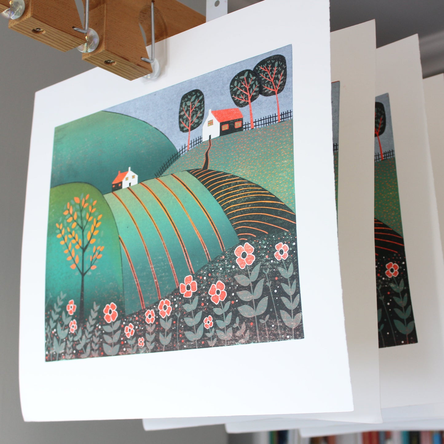 The Path Home limited edition linocut prints drying in the studio, hand-printed by Layla Khani