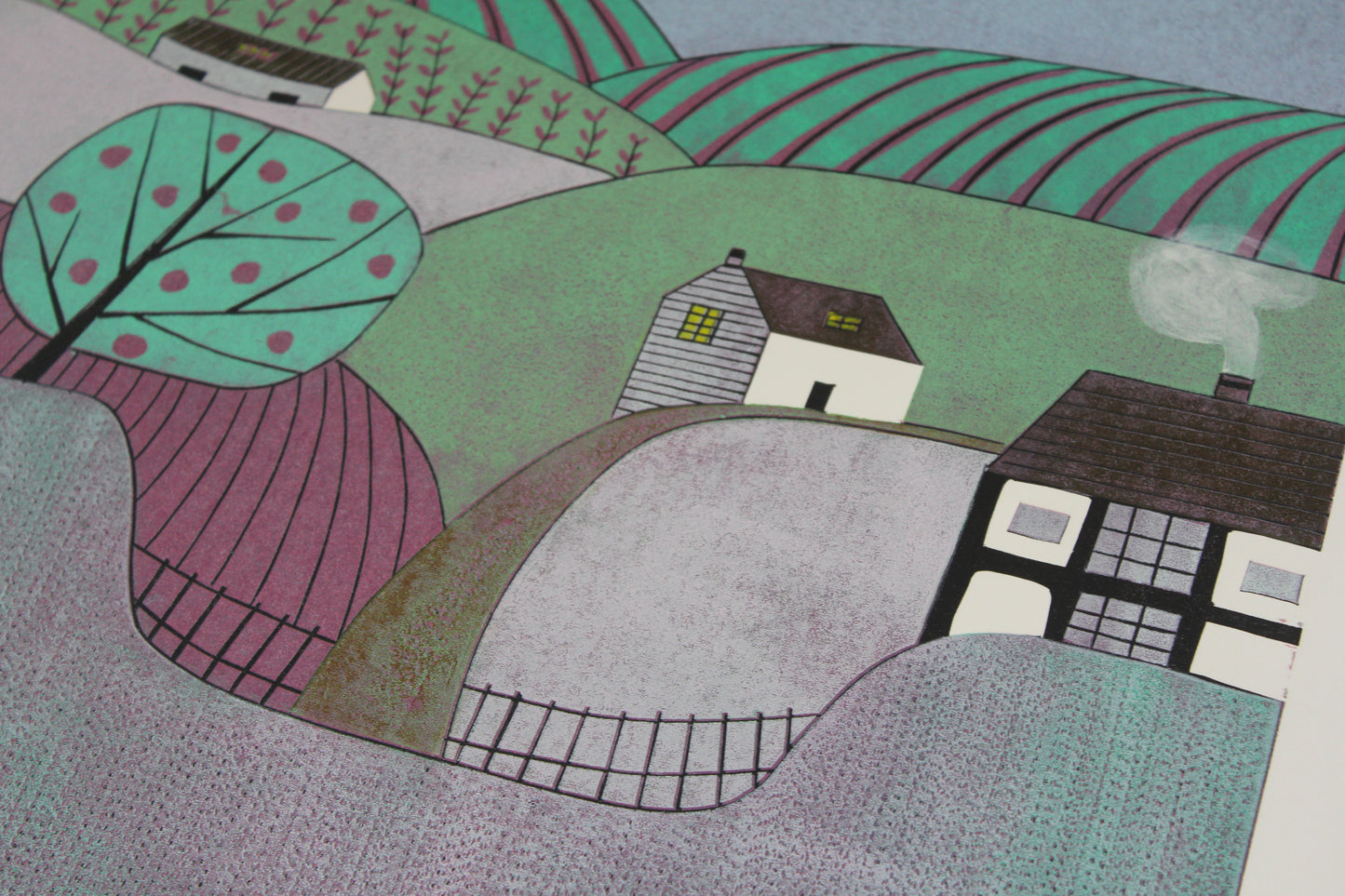 Close-up of the hand-printed texture and apple tree detail in the Apple Orchard linocut.
