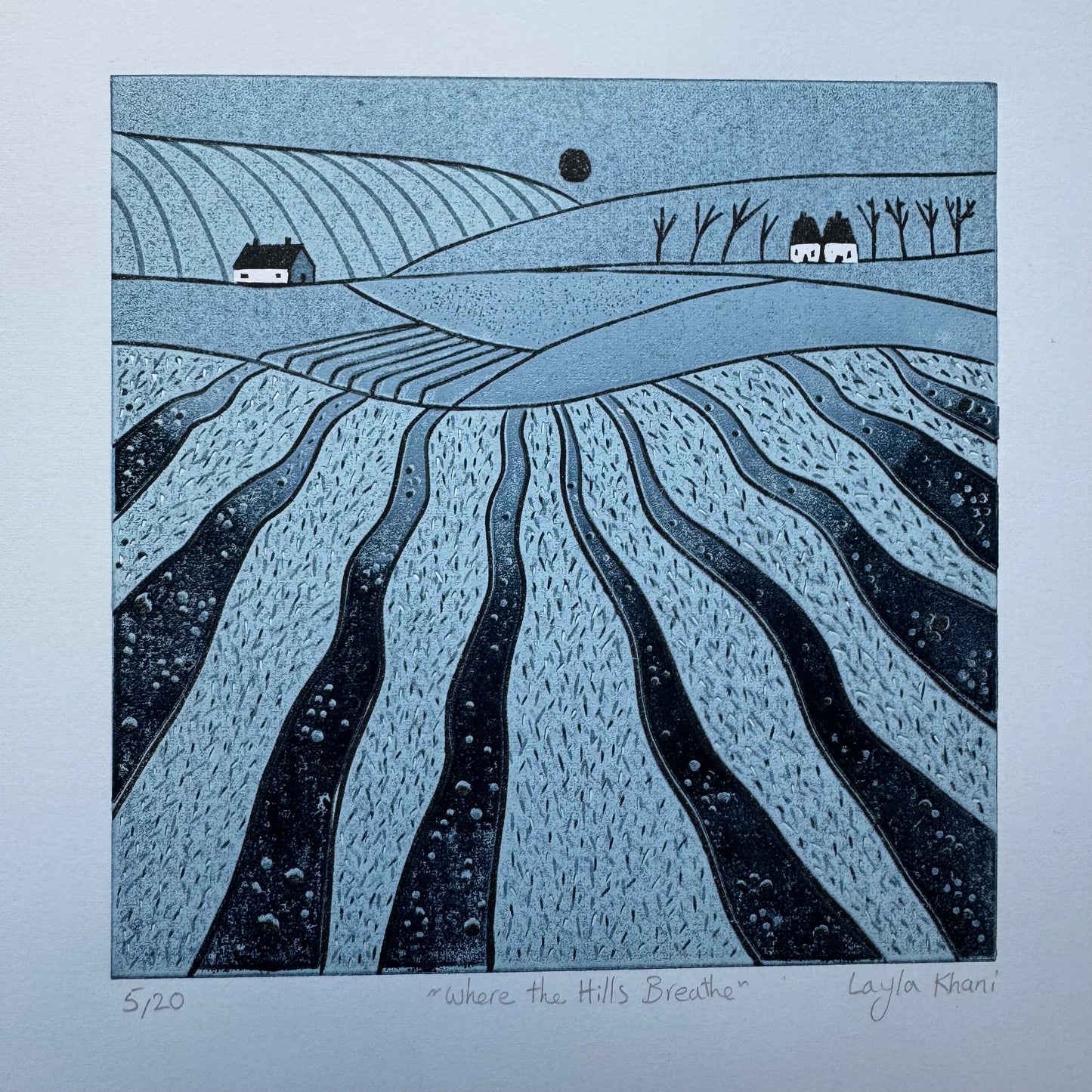 Where the Hills Breathe original hand-printed linocut showing the complete blue countryside artwork with its white paper border, title and signature.