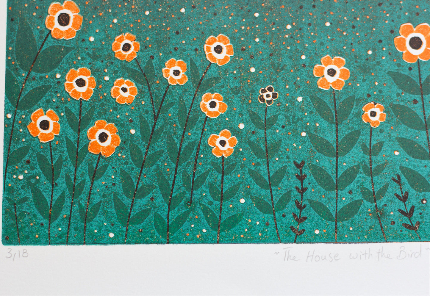 Close-up of The House with the Bird reduction linocut print showing orange flowers, hand-printed texture, edition number and handwritten title.