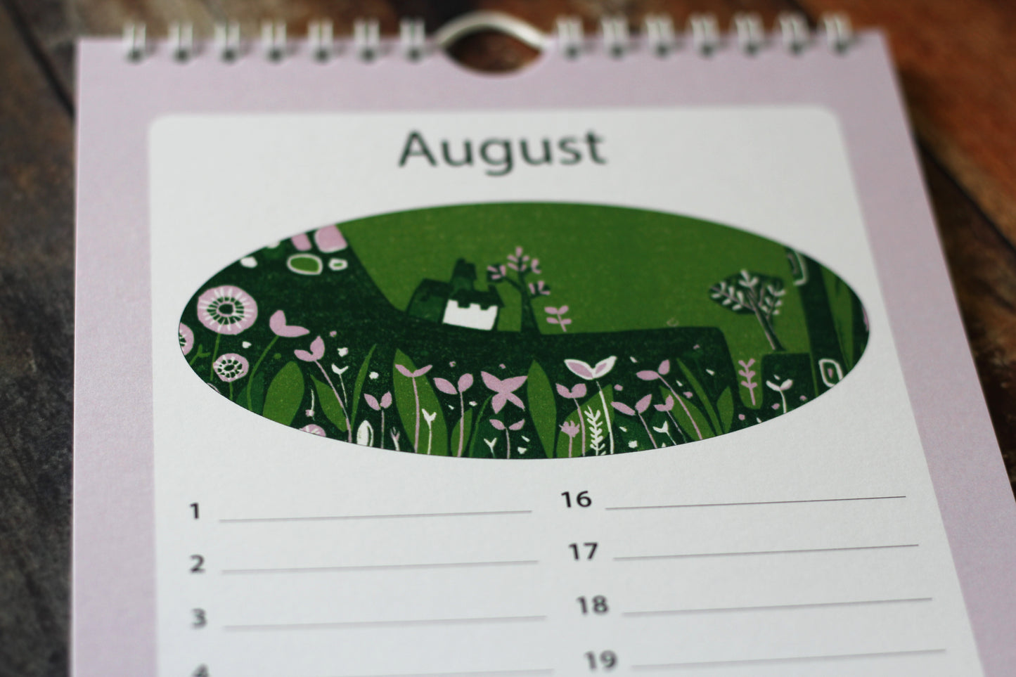 Laylart linocut birthday calendar open to August with floral meadow print