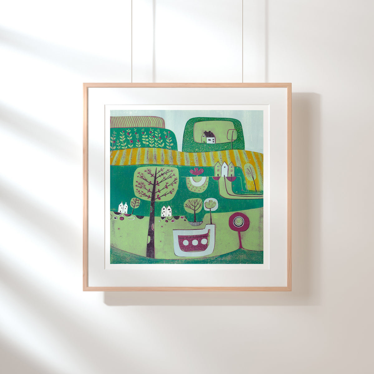 A Midsummer Breeze square linocut print shown framed with a wide white mount