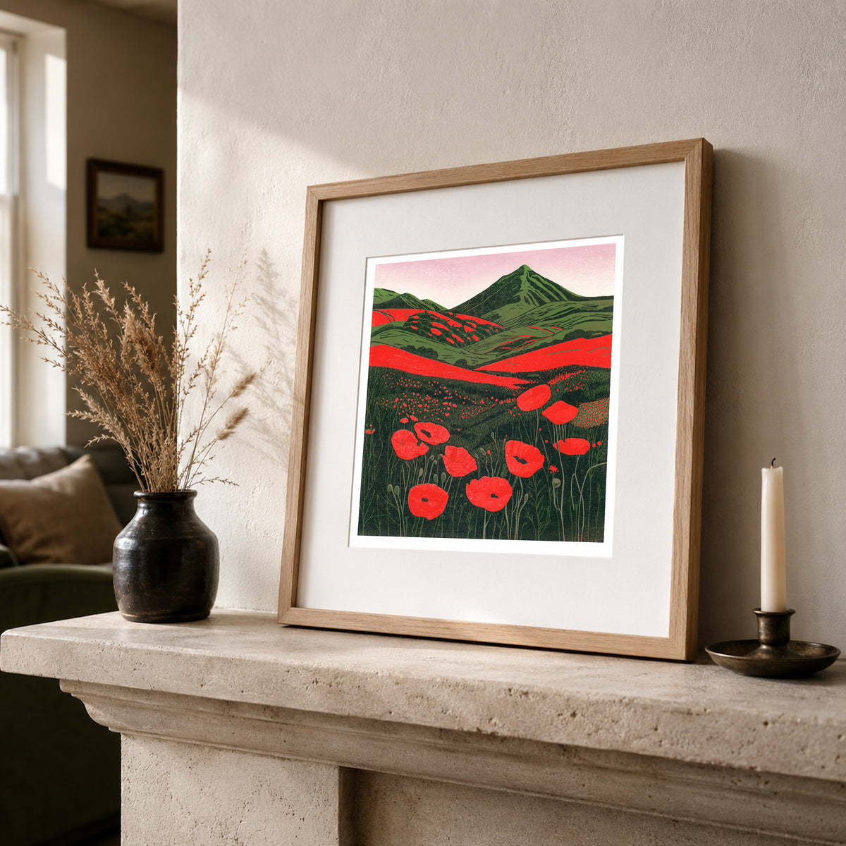 Hillside Poppies in Bloom colourful poppy linocut print framed and leaning on a shelf