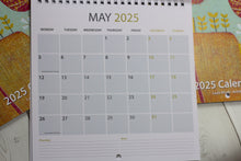 Load image into Gallery viewer, May 2025 calendar listing with a stunning linocut design by Layla Khani from Laylart Studio.