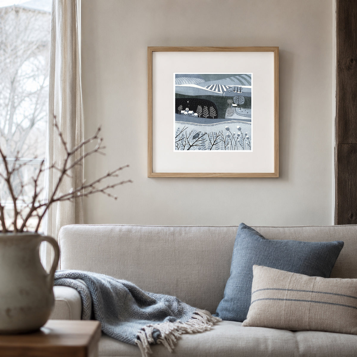 Wild Winter original landscape linocut print framed and displayed on a wall
