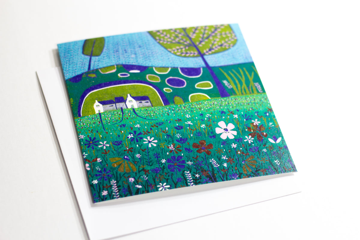 A Late Summer Day square linocut greeting card displayed on a table with an envelope 