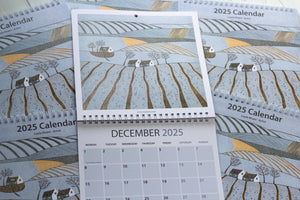 December 2025 page with a festive linocut print by Layla Khani, part of a 2025 large square wall calendar.