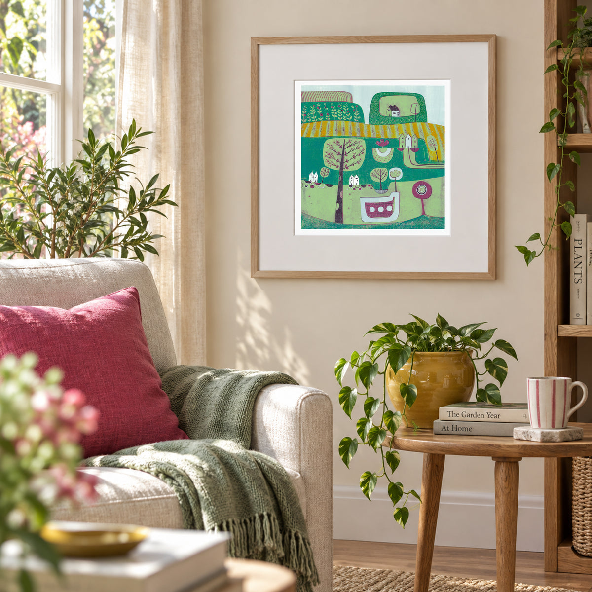 Framed A Midsummer Breeze linocut print displayed above a sofa in a contemporary interior