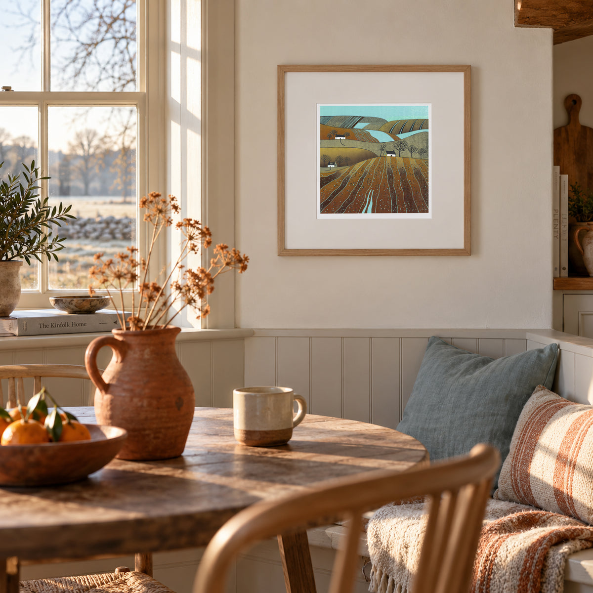 In the Tide of Autumn Leaves framed linocut print displayed in a warm dining room