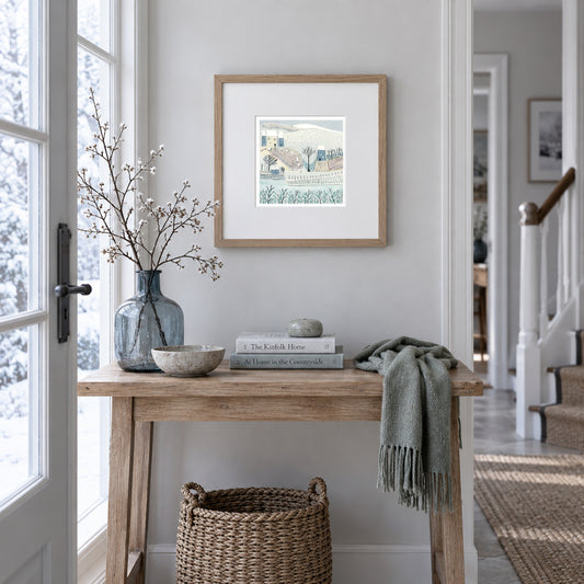 Blue Winter framed original linocut print displayed in a light contemporary interior