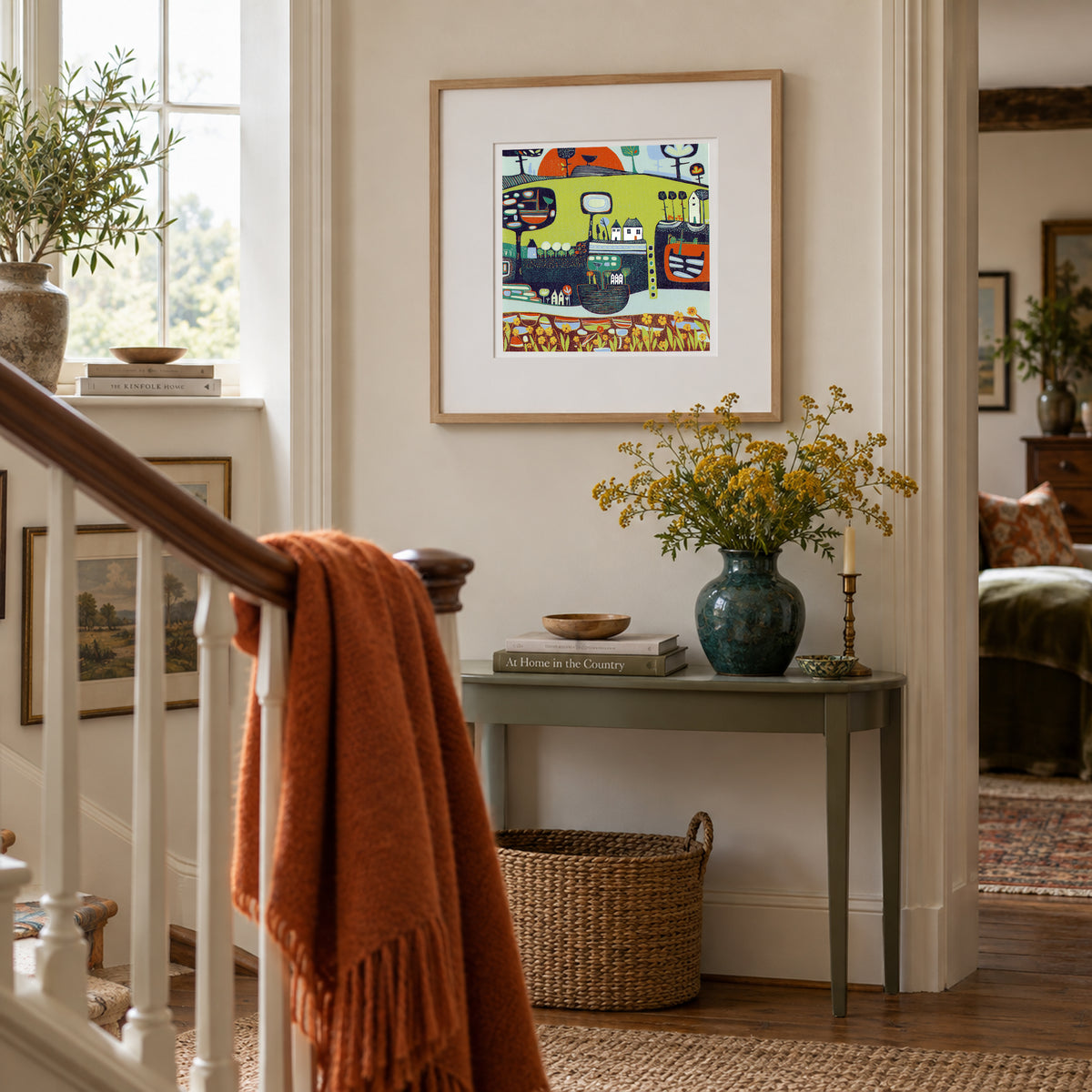 A Glorious Sight framed landscape linocut print displayed in a colourful home interior