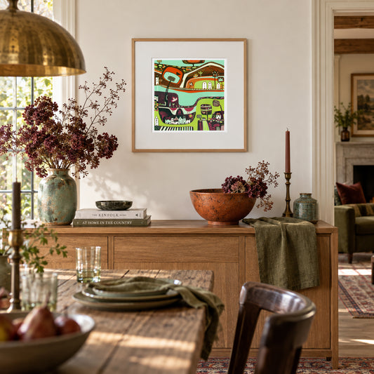 A Handful of Memories framed original linocut print displayed in a warm dining room