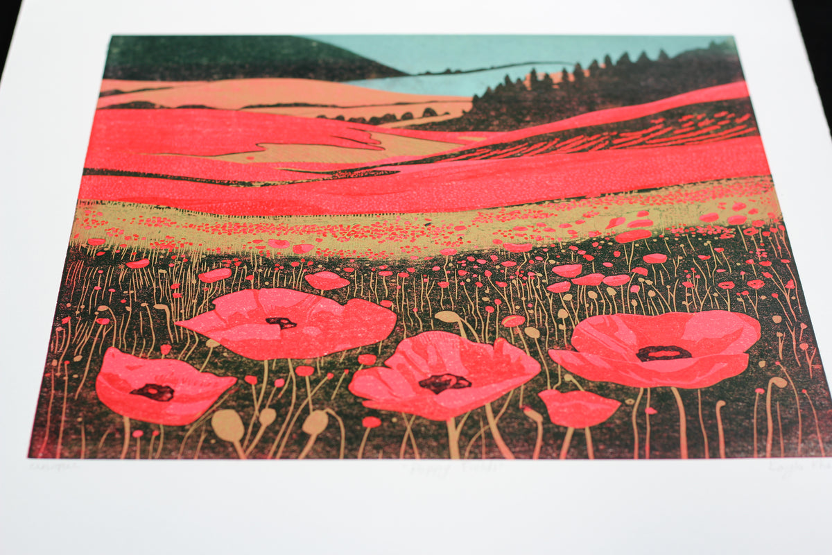 Close-up detail of red poppies and rolling fields in Poppy Fields original linocut