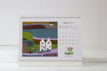 Load image into Gallery viewer, March 2024 page of the Desktop Calendar, showcasing a picturesque linocut print on the left, depicting a charming scene in vibrant hues, while on the right, a month-at-a-glance layout provides dates and days for quick access.