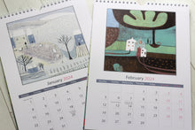 Load image into Gallery viewer, Display of two calendars side by side, featuring the January 2024 and February 2024 pages. Each page showcases a unique linocut print that beautifully captures the essence of the respective seasons.