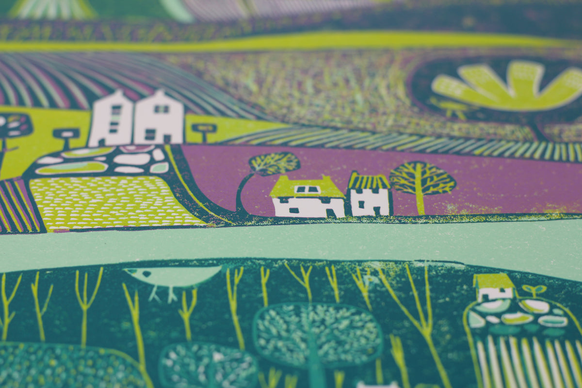 Detail showing houses, layered fields and hand-printed textures in Green Valley linocut print