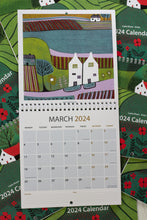 Load image into Gallery viewer, March 2024 calendar page showcasing a vibrant linocut print of a rural landscape, featuring a charming house and colorful scenery