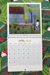 March 2024 calendar page featuring a quaint house adorned with vibrant red flowers, accompanied by date and day displays, along with space for notes and priorities.