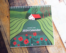Load image into Gallery viewer, Cover of the 2024 Square Linocut Wall Calendar