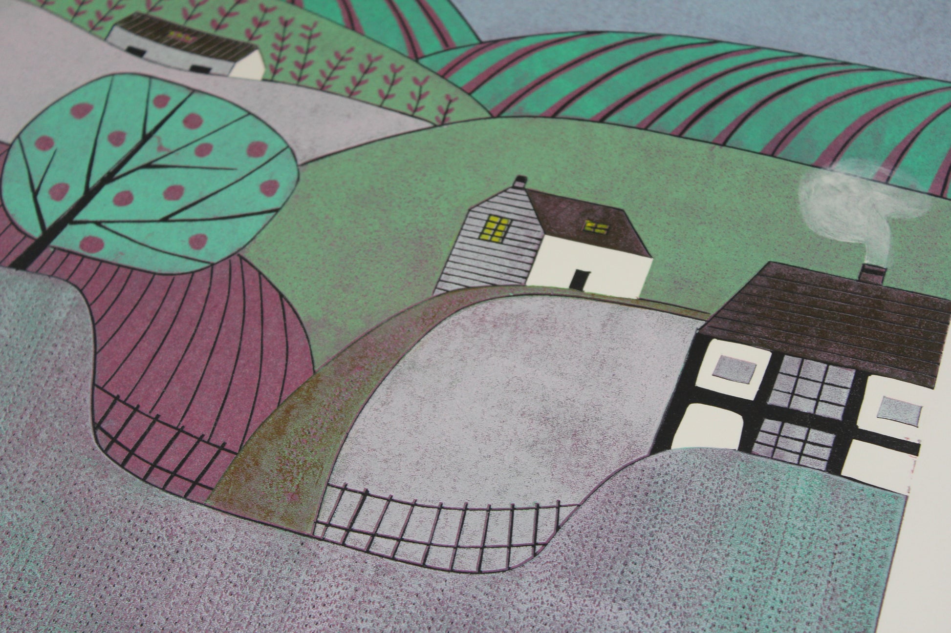 Close-up of the hand-printed texture and apple tree detail in the Apple Orchard linocut.