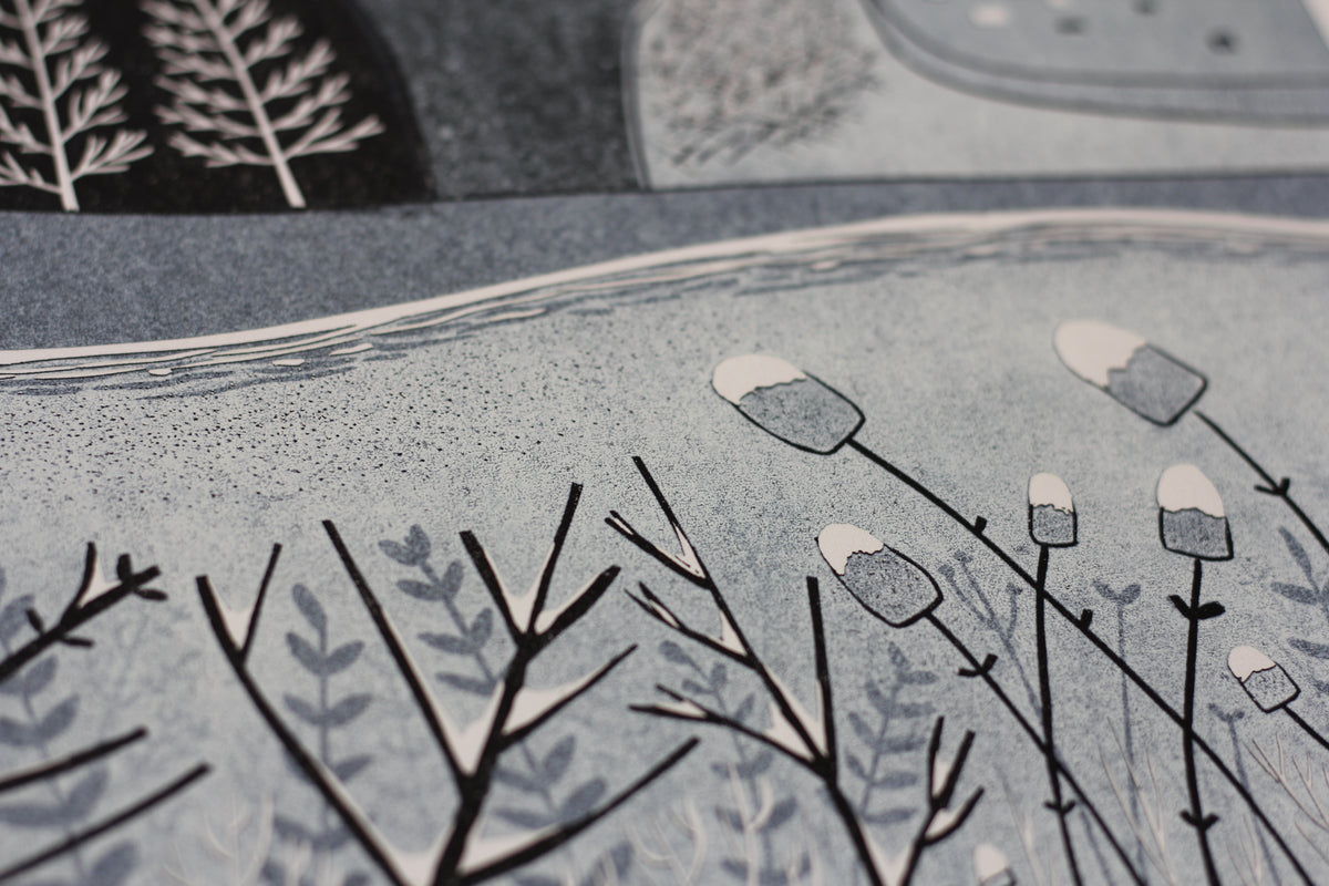 Hand-carved textures and layered countryside detail in Wild Winter linocut print
