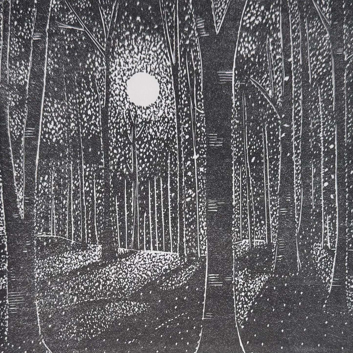 Whispers of Moonlight original black and white linocut print of a full moon shining through woodland

