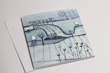 Load image into Gallery viewer, Christmas card from the Wintry Wonders Collection, illustrating a peaceful snow-covered landscape in muted blues and grays with a snowing effect, rendered in a detailed linocut print.