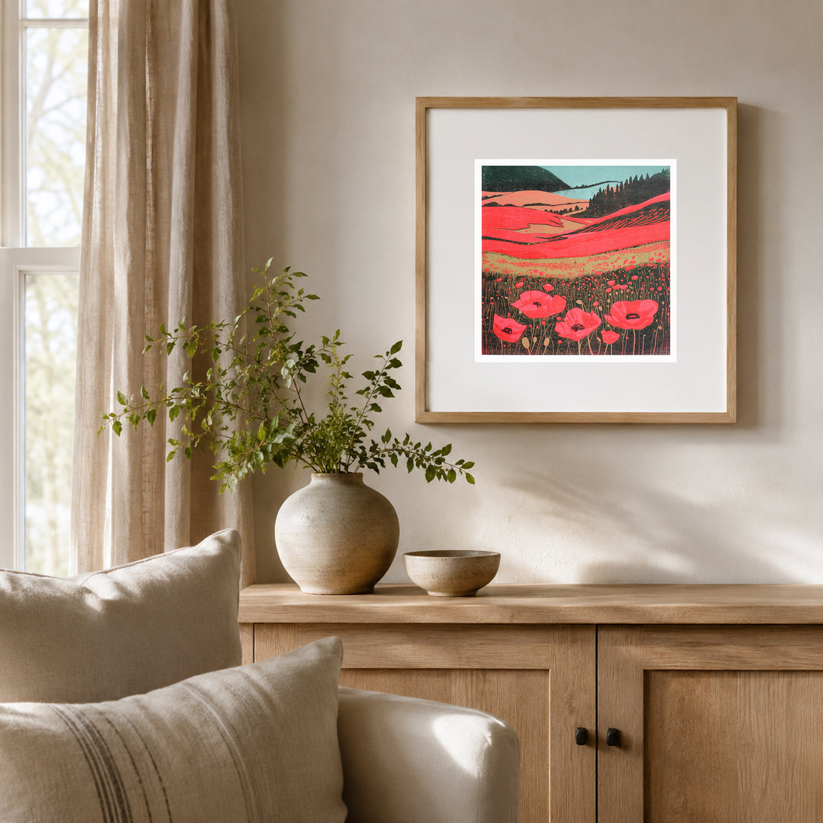 Poppy Fields original linocut print displayed framed above a wooden sideboard
