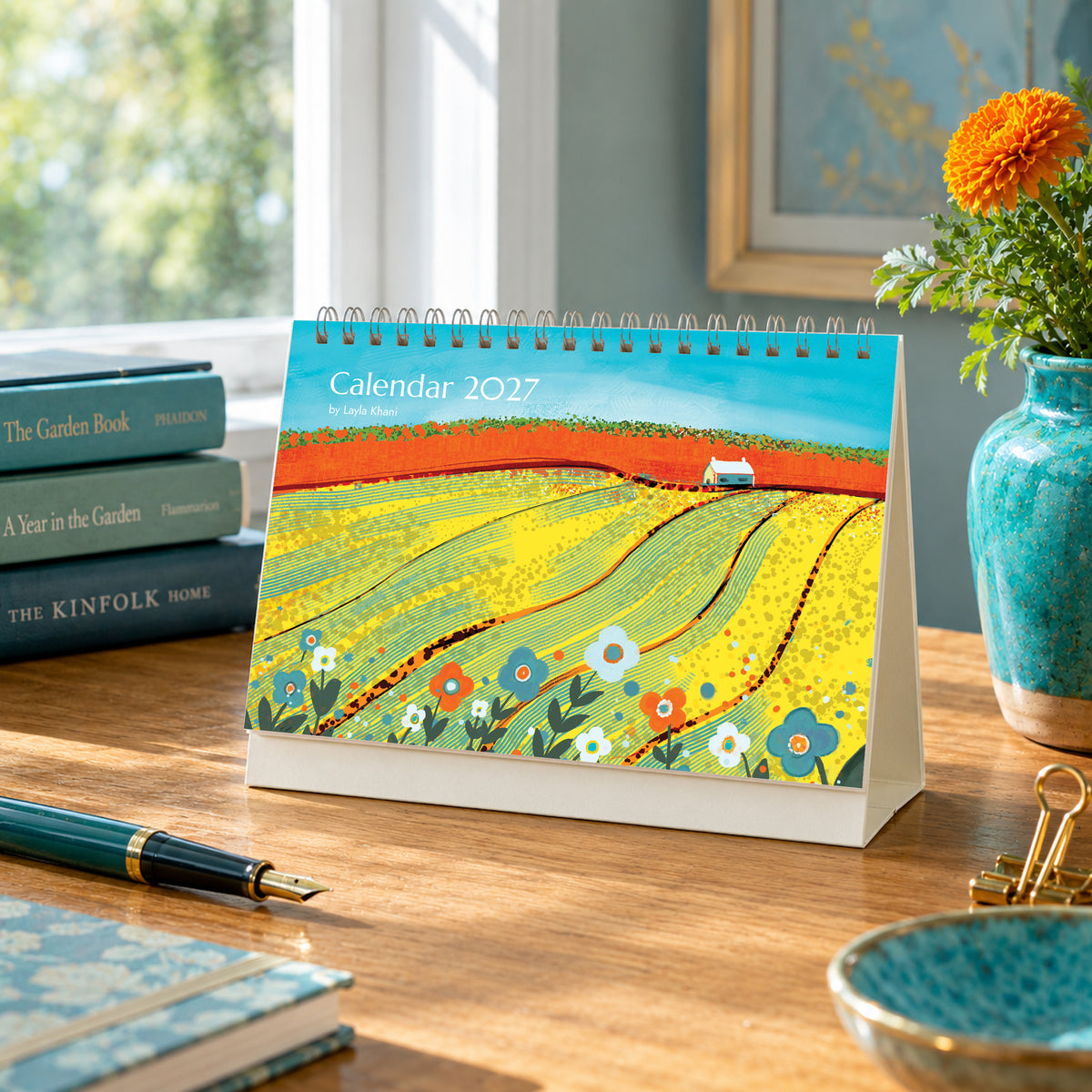 2027 art desk calendar cover featuring colourful countryside painting by Layla Khani