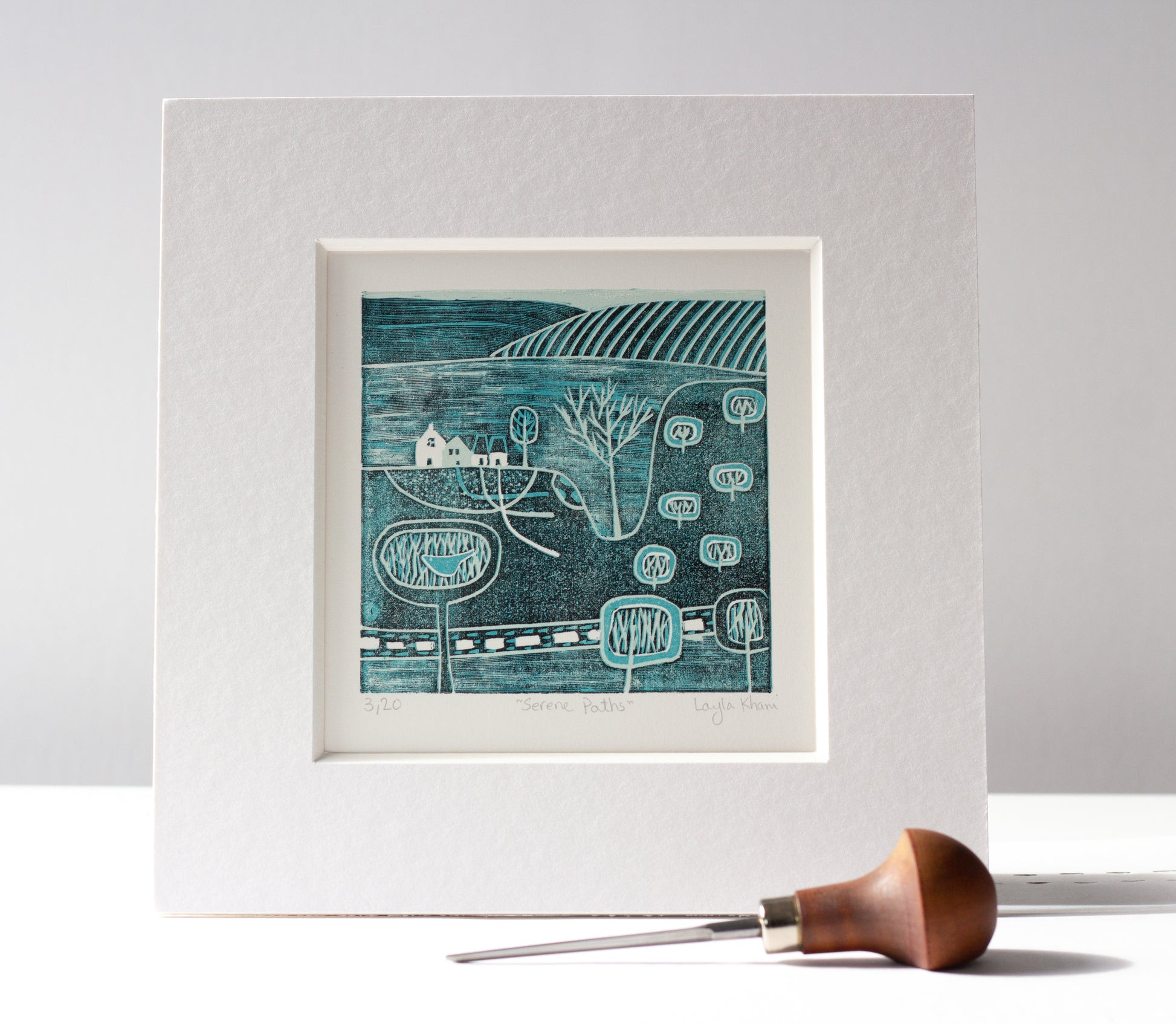 Serene Paths mini linocut print mounted with carving tool, hand-crafted by Layla Khani