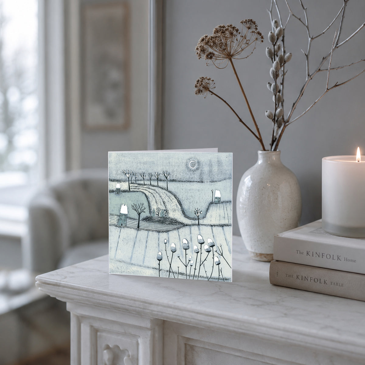 There Is Wonder in the Air Christmas greeting card displayed with candle and winter branches 